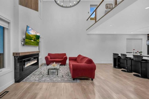 95 Saddlepeace Way Ne, Calgary, AB - Indoor With Fireplace