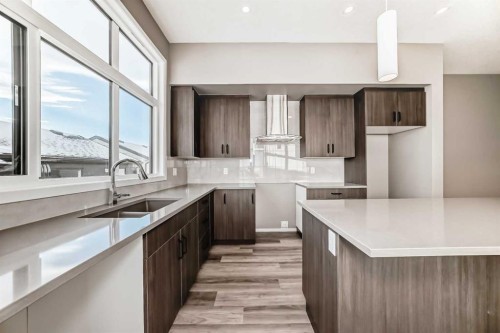 155 Sawgrass Gate Nw, Airdrie, AB - Indoor Photo Showing Kitchen With Double Sink With Upgraded Kitchen