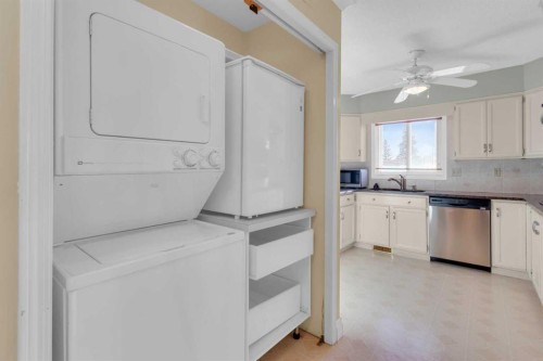 12 Vandoos Villas Nw, Calgary, AB - Indoor Photo Showing Laundry Room