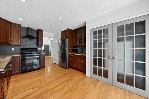 22 Shawinigan Rise Sw, Calgary, AB - Indoor Photo Showing Kitchen With Stainless Steel Kitchen With Double Sink