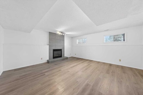 22 Shawinigan Rise Sw, Calgary, AB - Indoor With Fireplace
