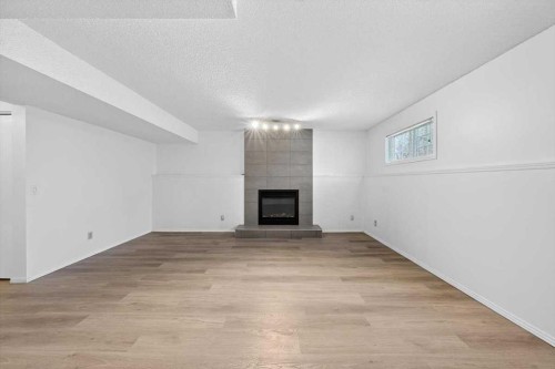 22 Shawinigan Rise Sw, Calgary, AB - Indoor With Fireplace