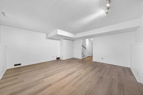 22 Shawinigan Rise Sw, Calgary, AB - Indoor Photo Showing Other Room