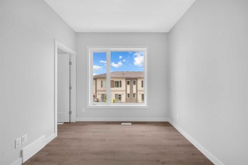 305 Shawnee Square Sw, Calgary, AB - Indoor Photo Showing Other Room