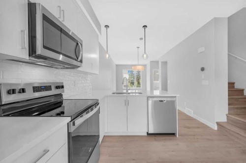 305 Shawnee Square Sw, Calgary, AB - Indoor Photo Showing Kitchen With Stainless Steel Kitchen