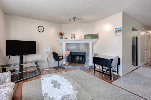 5 Fonda Drive Se, Calgary, AB - Indoor Photo Showing Living Room With Fireplace