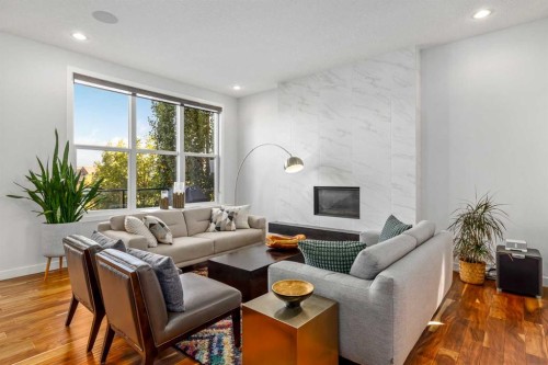 10 Cranbrook Hill Se, Calgary, AB - Indoor Photo Showing Living Room With Fireplace