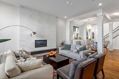 10 Cranbrook Hill Se, Calgary, AB - Indoor Photo Showing Living Room With Fireplace