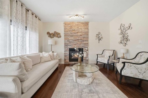 65 Sage Hill Landing Nw, Calgary, AB - Indoor Photo Showing Living Room With Fireplace