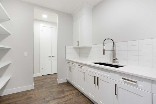 74 Cimarron Estates Drive, Okotoks, AB - Indoor Photo Showing Kitchen With Double Sink