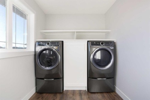 74 Cimarron Estates Drive, Okotoks, AB - Indoor Photo Showing Laundry Room