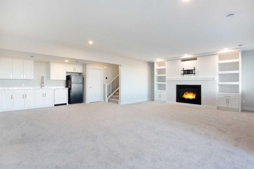 74 Cimarron Estates Drive, Okotoks, AB - Indoor Photo Showing Other Room With Fireplace