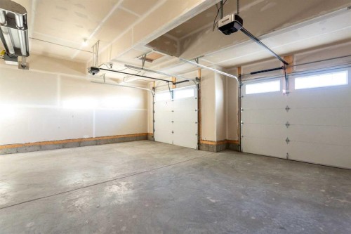 74 Cimarron Estates Drive, Okotoks, AB - Indoor Photo Showing Garage