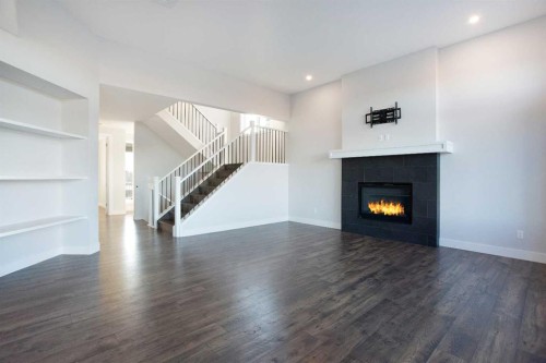 74 Cimarron Estates Drive, Okotoks, AB - Indoor Photo Showing Living Room With Fireplace