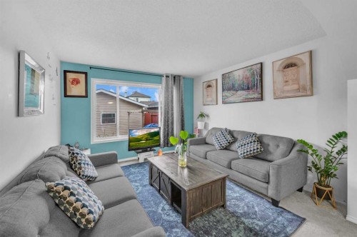 144 Saddlecrest Place Ne, Calgary, AB - Indoor Photo Showing Living Room