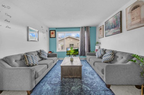 144 Saddlecrest Place Ne, Calgary, AB - Indoor Photo Showing Living Room