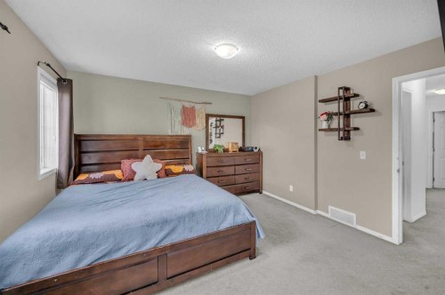 144 Saddlecrest Place Ne, Calgary, AB - Indoor Photo Showing Bedroom
