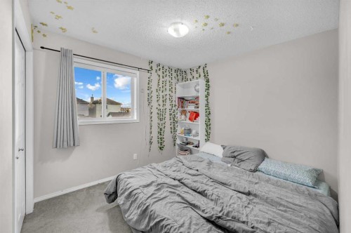144 Saddlecrest Place Ne, Calgary, AB - Indoor Photo Showing Bedroom