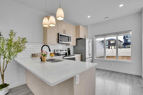 131 Lucas Boulevard, Calgary, AB - Indoor Photo Showing Kitchen With Double Sink With Upgraded Kitchen