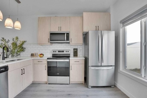 131 Lucas Boulevard, Calgary, AB - Indoor Photo Showing Kitchen With Double Sink