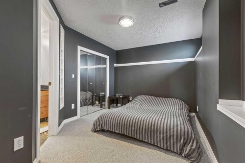 111 Edgebyne Crescent Nw, Calgary, AB - Indoor Photo Showing Bedroom