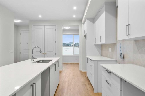 107 Royston Way Nw, Calgary, AB - Indoor Photo Showing Kitchen With Double Sink