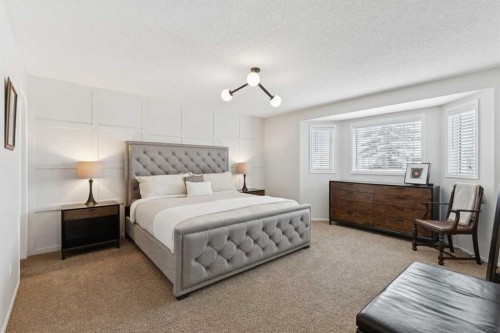 33 River Rock Crescent Se, Calgary, AB - Indoor Photo Showing Bedroom