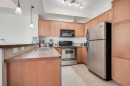301-208 Holy Cross Lane Sw, Calgary, AB  - Indoor Photo Showing Kitchen With Double Sink 