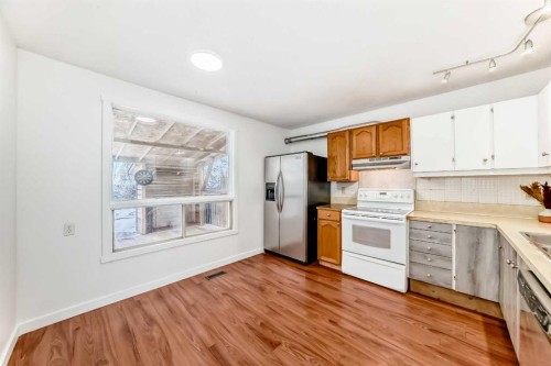51A Fonda Green Se, Calgary, AB - Indoor Photo Showing Kitchen With Double Sink