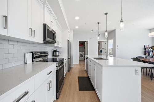 3207-220 Seton Grove Se, Calgary, AB - Indoor Photo Showing Kitchen With Double Sink With Upgraded Kitchen