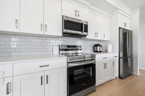 3207-220 Seton Grove Se, Calgary, AB - Indoor Photo Showing Kitchen