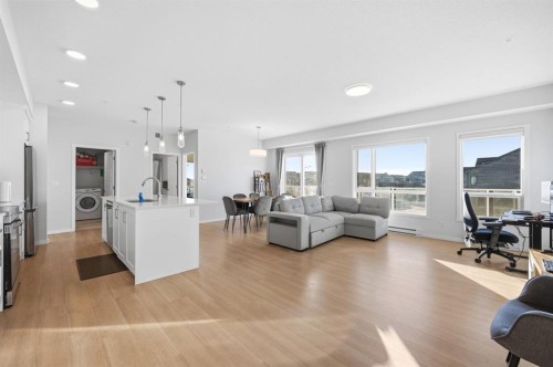 3207-220 Seton Grove Se, Calgary, AB - Indoor Photo Showing Living Room