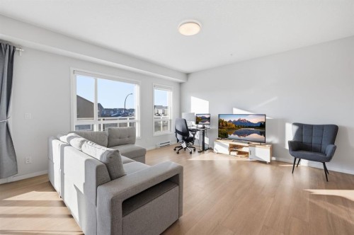 3207-220 Seton Grove Se, Calgary, AB - Indoor Photo Showing Living Room
