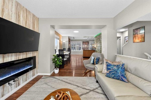 303 New Brighton Villas Se, Calgary, AB - Indoor Photo Showing Living Room With Fireplace