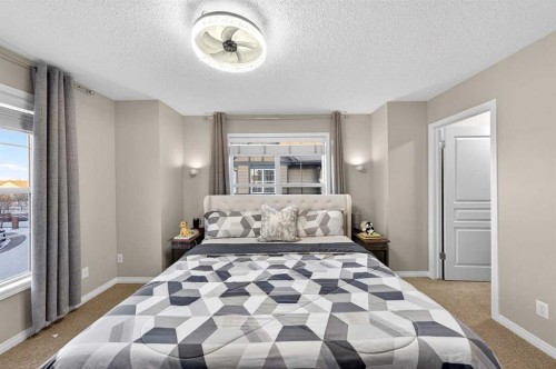 303 New Brighton Villas Se, Calgary, AB - Indoor Photo Showing Bedroom