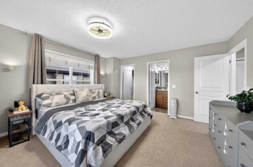 303 New Brighton Villas Se, Calgary, AB - Indoor Photo Showing Bedroom