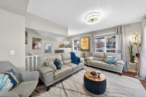 303 New Brighton Villas Se, Calgary, AB - Indoor Photo Showing Living Room