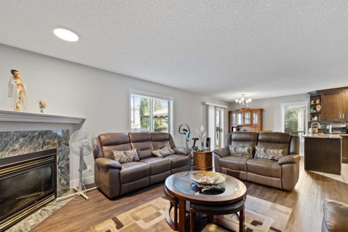 86 Coral Springs Close Ne, Calgary, AB - Indoor Photo Showing Living Room With Fireplace