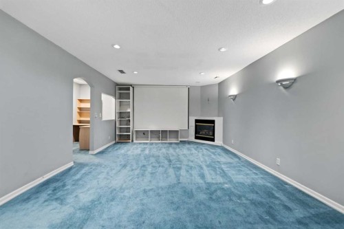 86 Coral Springs Close Ne, Calgary, AB - Indoor Photo Showing Other Room With Fireplace