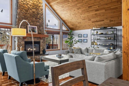 107-210 Hubman Landing, Canmore, AB - Indoor Photo Showing Living Room With Fireplace