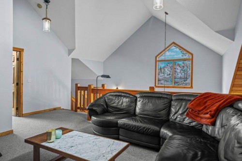 107-210 Hubman Landing, Canmore, AB - Indoor Photo Showing Living Room