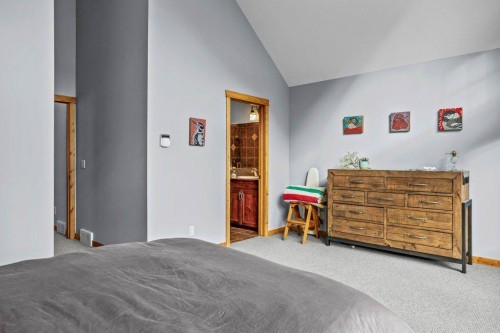 107-210 Hubman Landing, Canmore, AB - Indoor Photo Showing Bedroom