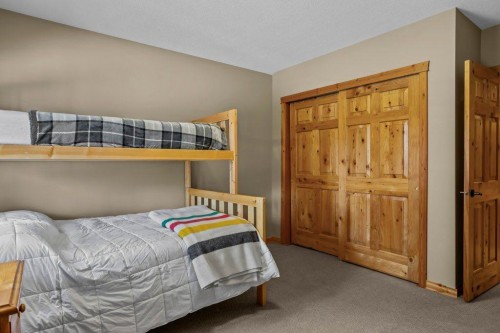 107-210 Hubman Landing, Canmore, AB - Indoor Photo Showing Bedroom