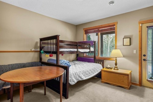 107-210 Hubman Landing, Canmore, AB - Indoor Photo Showing Bedroom
