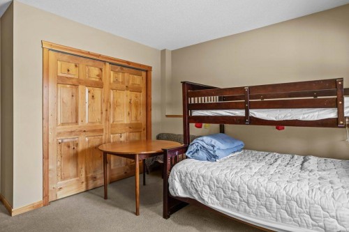 107-210 Hubman Landing, Canmore, AB - Indoor Photo Showing Bedroom