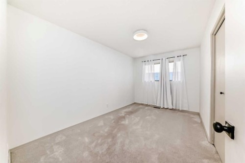 16 Bermondsey Crescent Nw, Calgary, AB - Indoor Photo Showing Other Room