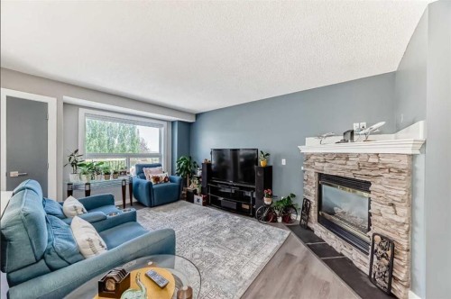 137 Coverton Circle Ne, Calgary, AB - Indoor Photo Showing Living Room With Fireplace
