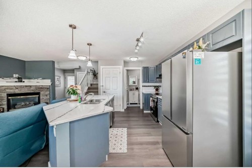 137 Coverton Circle Ne, Calgary, AB - Indoor Photo Showing Other Room With Fireplace