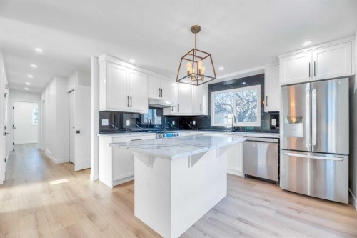 128 Cantrell Place Sw, Calgary, AB - Indoor Photo Showing Kitchen With Stainless Steel Kitchen