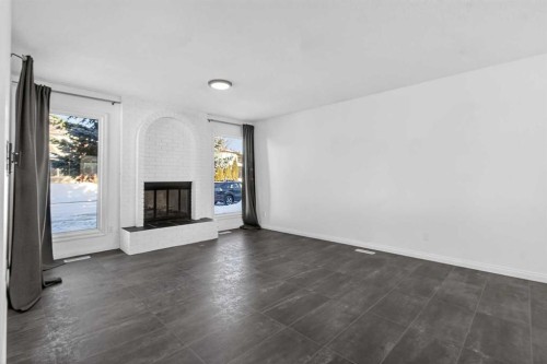 33 Sunhurst Crescent Se, Calgary, AB - Indoor Photo Showing Other Room With Fireplace